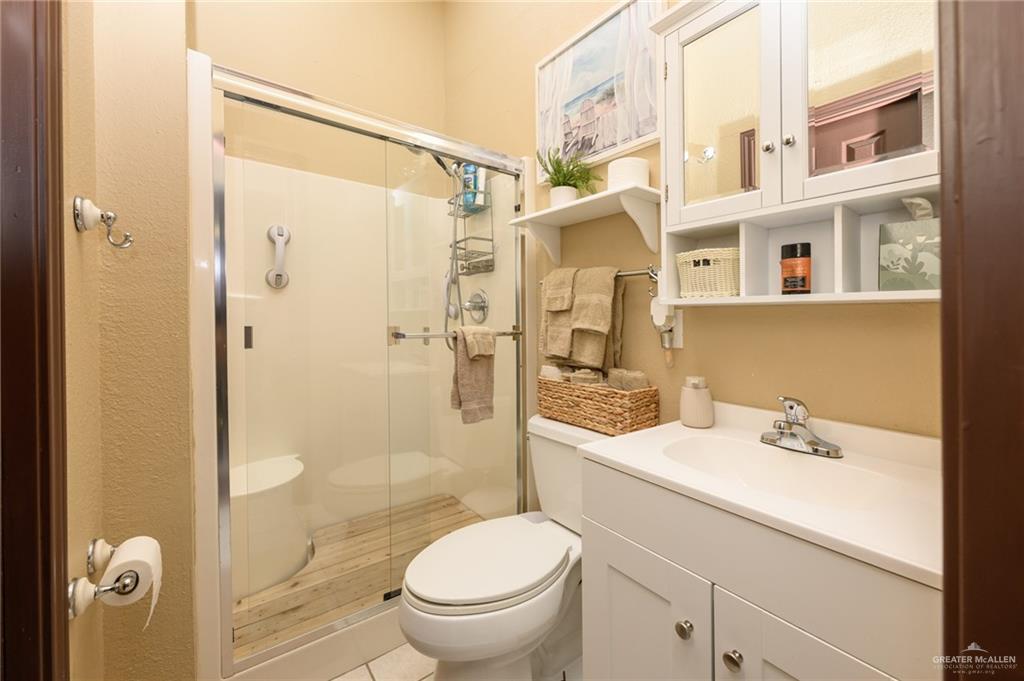 36431 Marshall Hutts Road Rio Hondo, TX 78583 - Photo 20 of 45 a bathroom with a sink toilet and shower