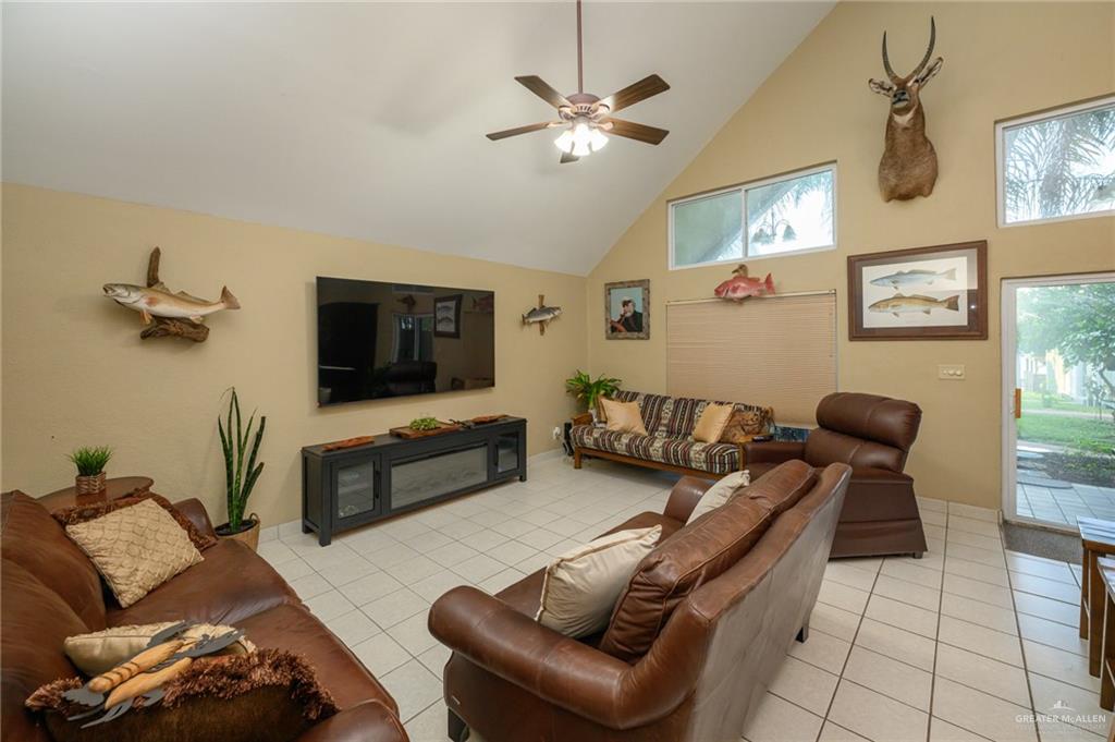 36431 Marshall Hutts Road Rio Hondo, TX 78583 - Photo 3 of 45 a living room with furniture and a flat screen tv