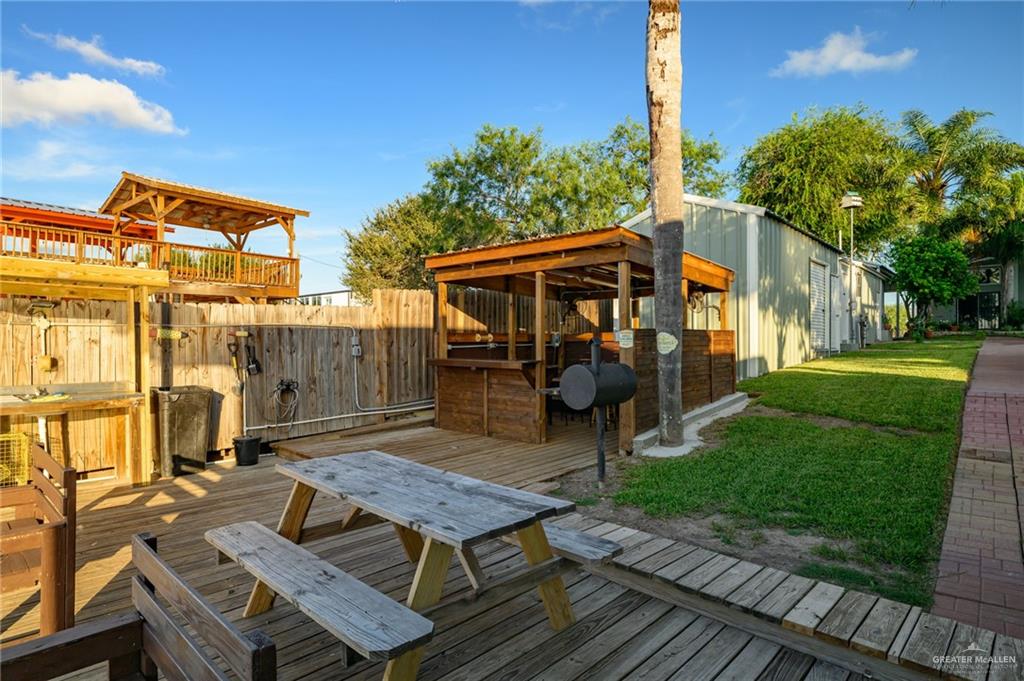 36431 Marshall Hutts Road Rio Hondo, TX 78583 - Photo 38 of 45 a view of a chairs and table on the patio