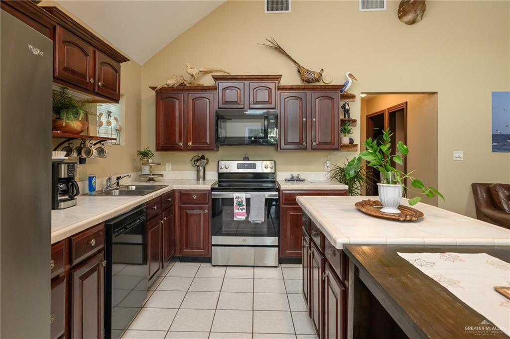 36431 Marshall Hutts Road Rio Hondo, TX 78583 - Photo 10 of 45 a kitchen with a sink stove and cabinets