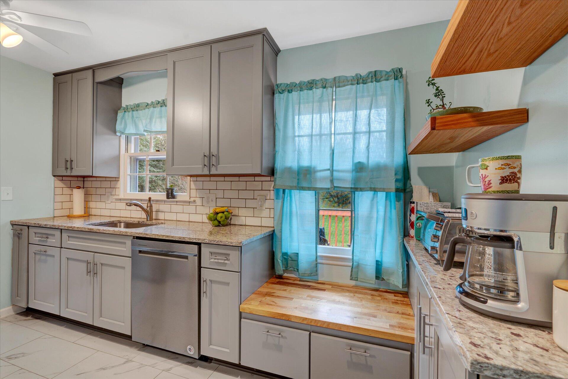 5533 Twilight Road Roanoke, VA 24019 - Photo 7 of 24 a kitchen with stainless steel appliances granite countertop a sink stove and cabinets