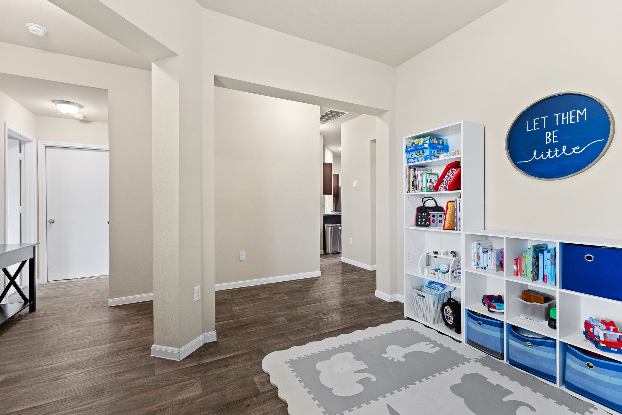 404 Cassandra Drive Hutto, TX 78634 - Photo 33 of 40 Playroom with dark wood finished floors and baseboards