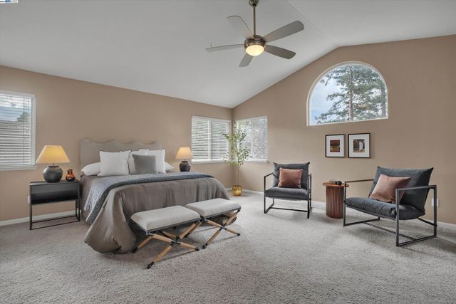 a bed room with furniture and a chandelier