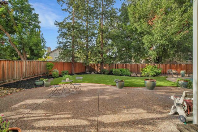 a view of street with wooden fence