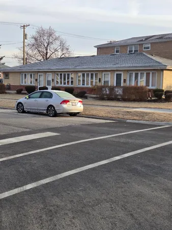 a view of street with parked cars