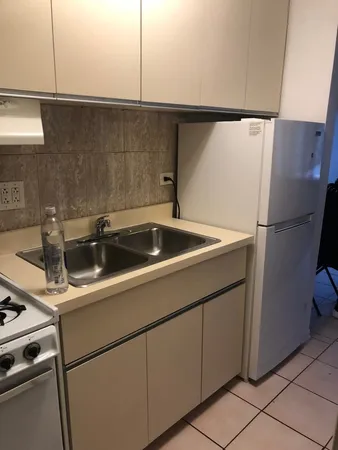 a close view of a sink and dishwasher