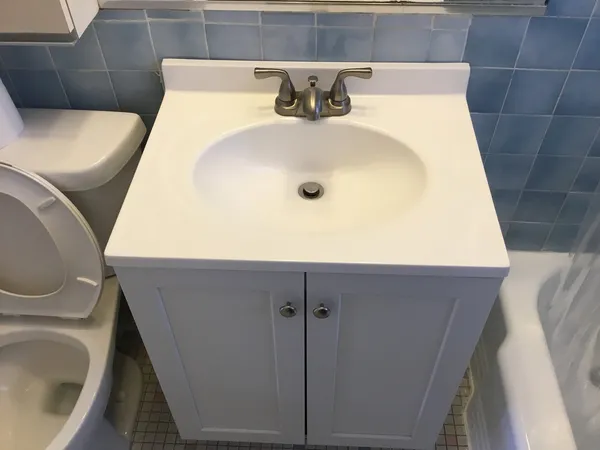 a bathroom with a sink and toilet