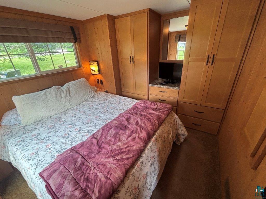 9436 Bear Ridge Drive Orr, MN 55771 - Photo 11 of 26 Bedroom with wood walls