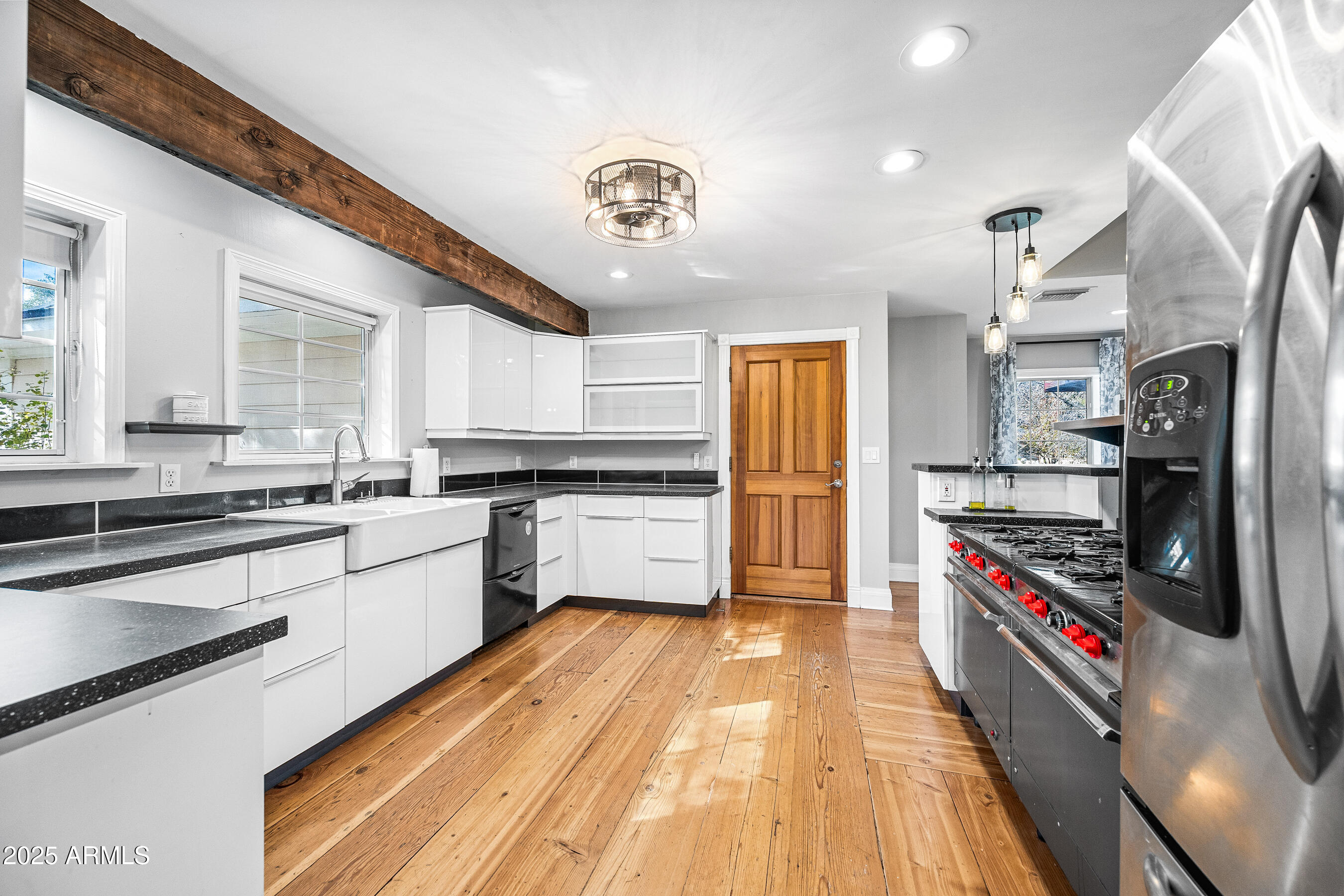 17288 Foothill Road Yarnell, AZ 85362 - Photo 14 of 79 a large kitchen with stainless steel appliances granite countertop a lot of counter space and wooden floor