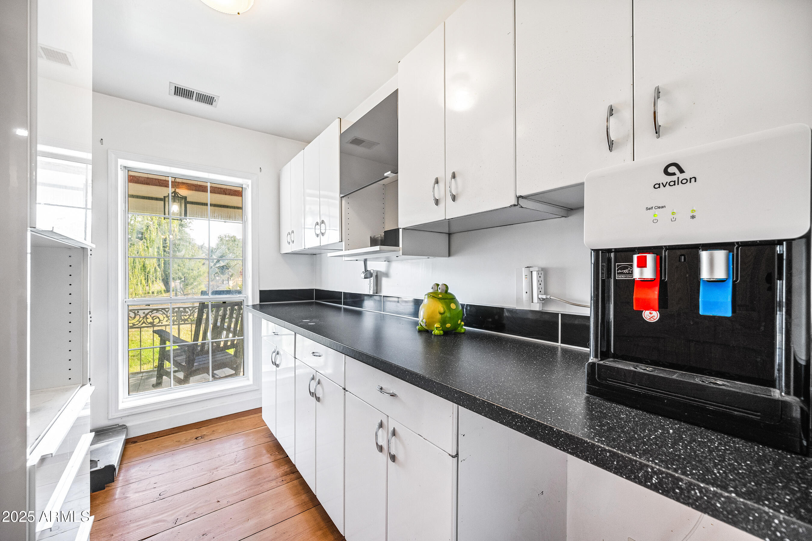 17288 Foothill Road Yarnell, AZ 85362 - Photo 19 of 79 a kitchen with stainless steel appliances granite countertop a sink a stove and a wooden floors
