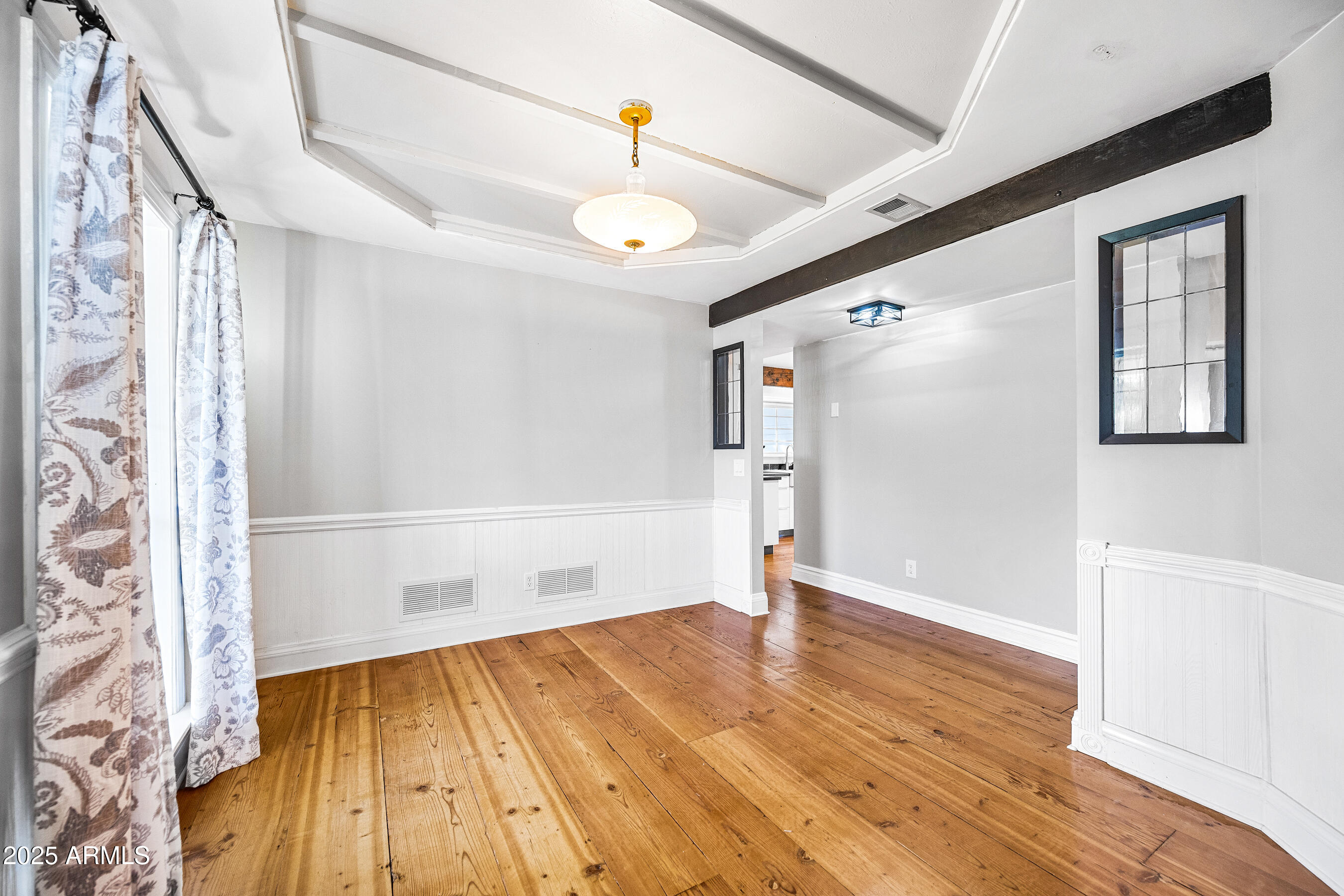 17288 Foothill Road Yarnell, AZ 85362 - Photo 23 of 79 a view of an empty room with wooden floor and a window