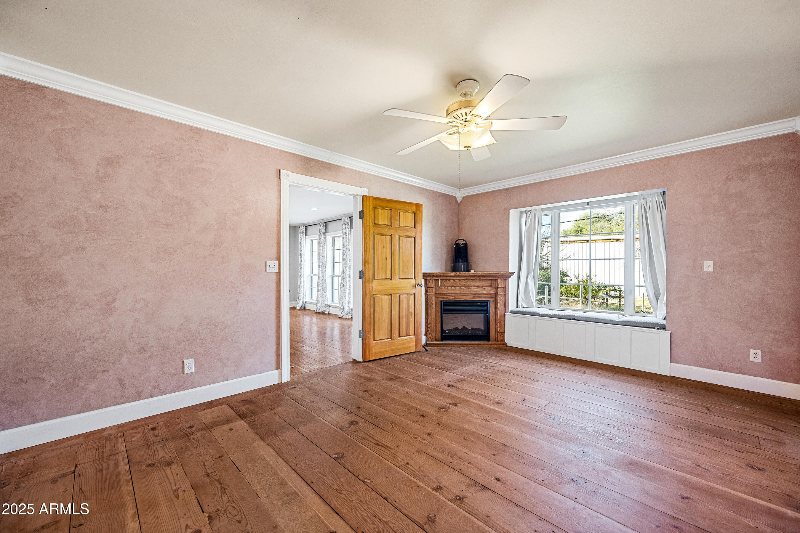 17288 Foothill Road Yarnell, AZ 85362 - Photo 34 of 79 a view of an empty room with a window and wooden floor