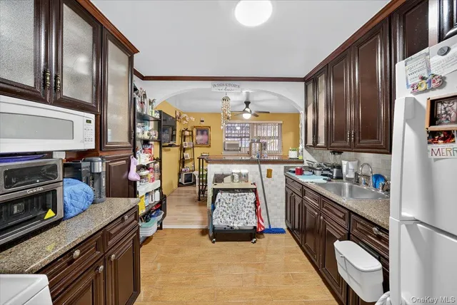 a kitchen with lots of appliances and cabinets