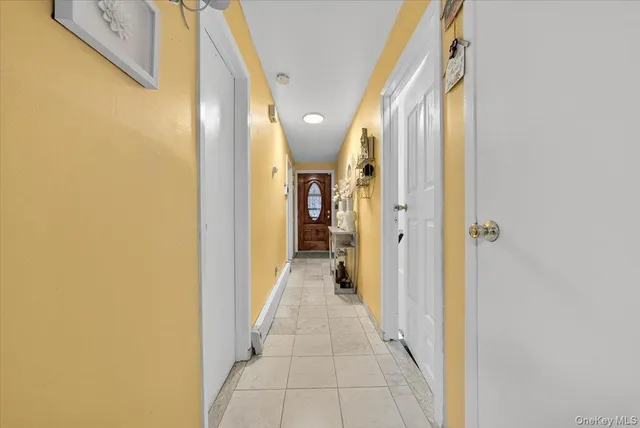 a view of hallway with wooden floor