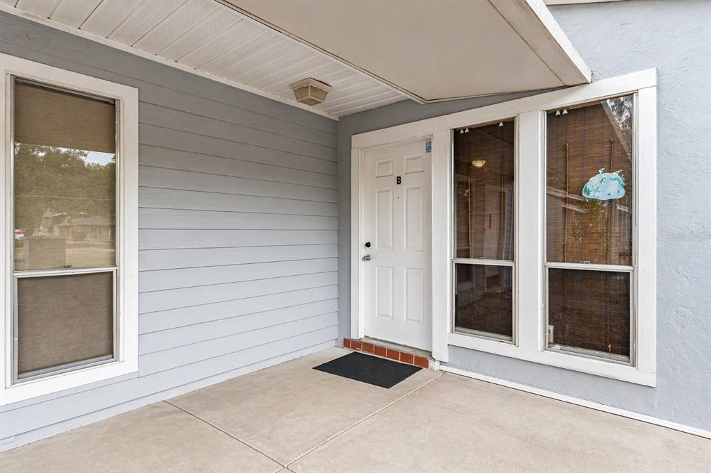 1420 Southwest 42nd Street, Unit B Gainesville, FL 32607 - Photo 1 of 36 a view of a door in front of a house