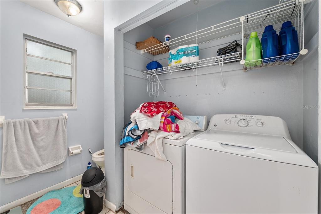 1420 Southwest 42nd Street, Unit B Gainesville, FL 32607 - Photo 27 of 36 a utility room with dryer and washer