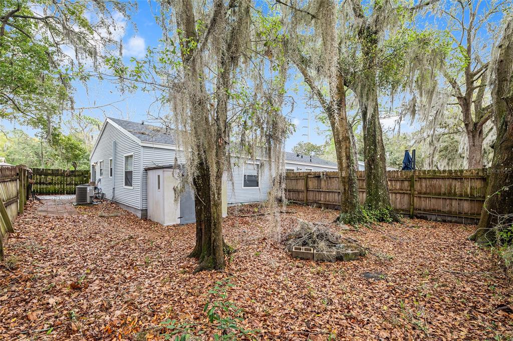 1420 Southwest 42nd Street, Unit B Gainesville, FL 32607 - Photo 34 of 36 a view of a house with a yard covered in snow