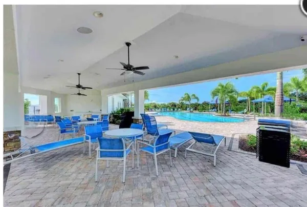 a view of a swimming pool with a yard