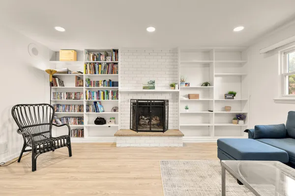 a living room with furniture and a fireplace