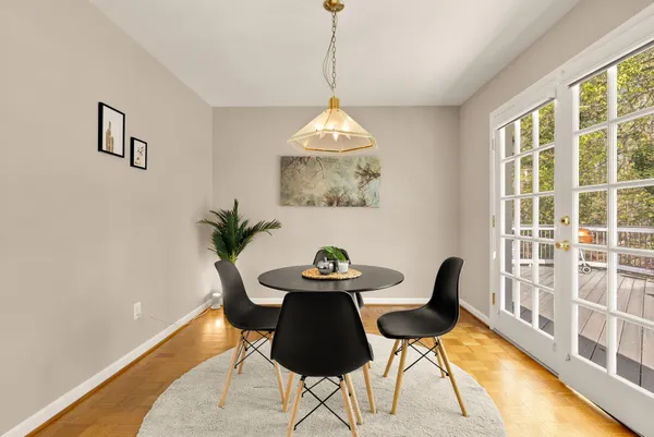 a dining room with furniture and window