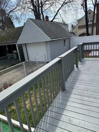 a balcony with wooden floor