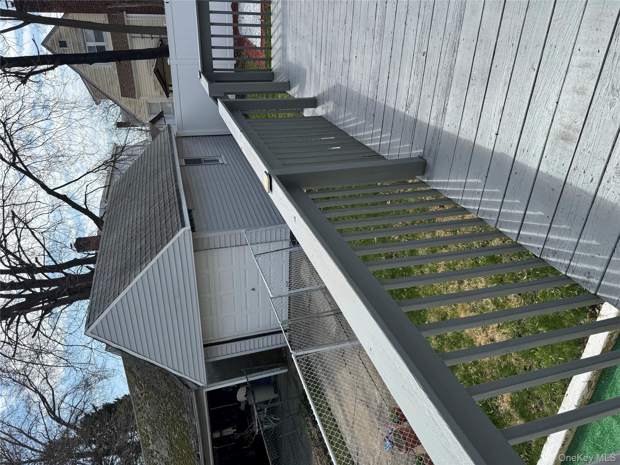 8 Frazier Street Hempstead, NY 11550 - Photo 2 of 7 a balcony with wooden floor