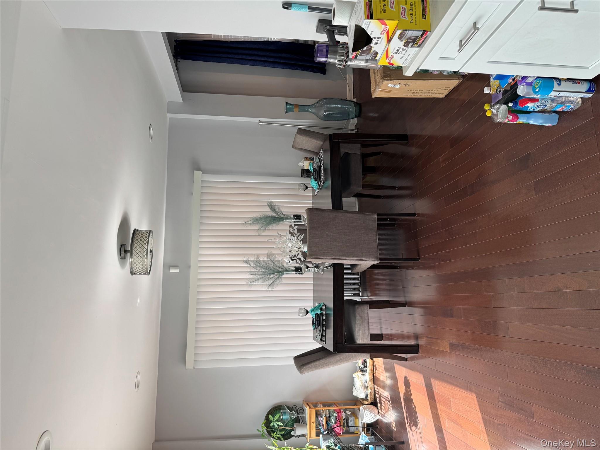 8 Frazier Street Hempstead, NY 11550 - Photo 6 of 7 a view of a dining room with furniture and wooden floor