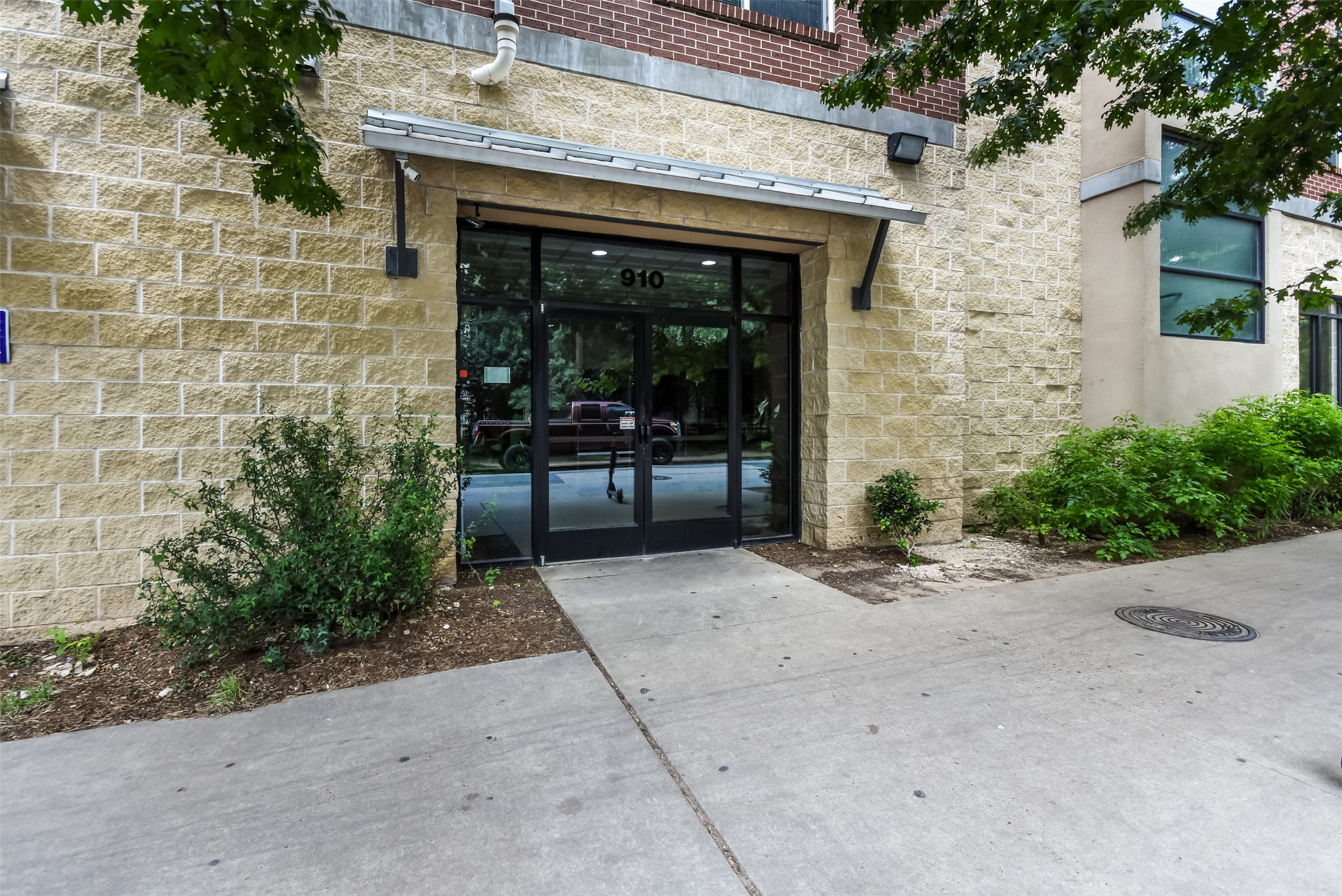 910 West 25th Street, Unit 503 Austin, TX 78705 - Photo 2 of 24 a front view of a house with a yard