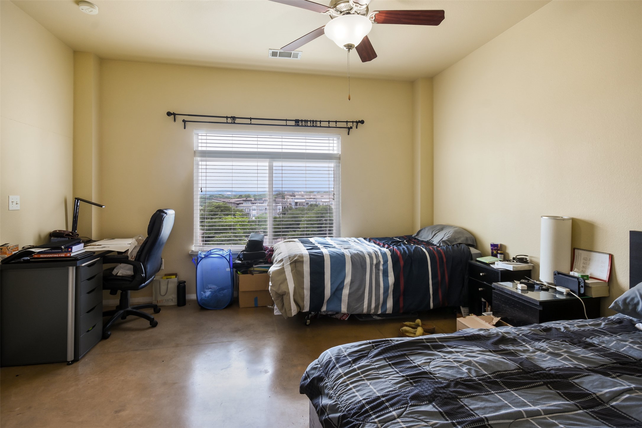 910 West 25th Street, Unit 503 Austin, TX 78705 - Photo 10 of 24 a bedroom with a bed and a desk