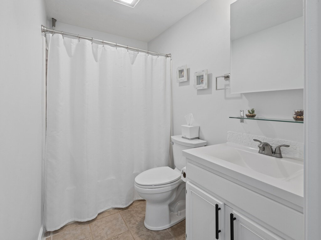 2 Stringer Dam Road Shrewsbury, MA 01545 - Photo 17 of 35 a bathroom with a sink a toilet and a mirror
