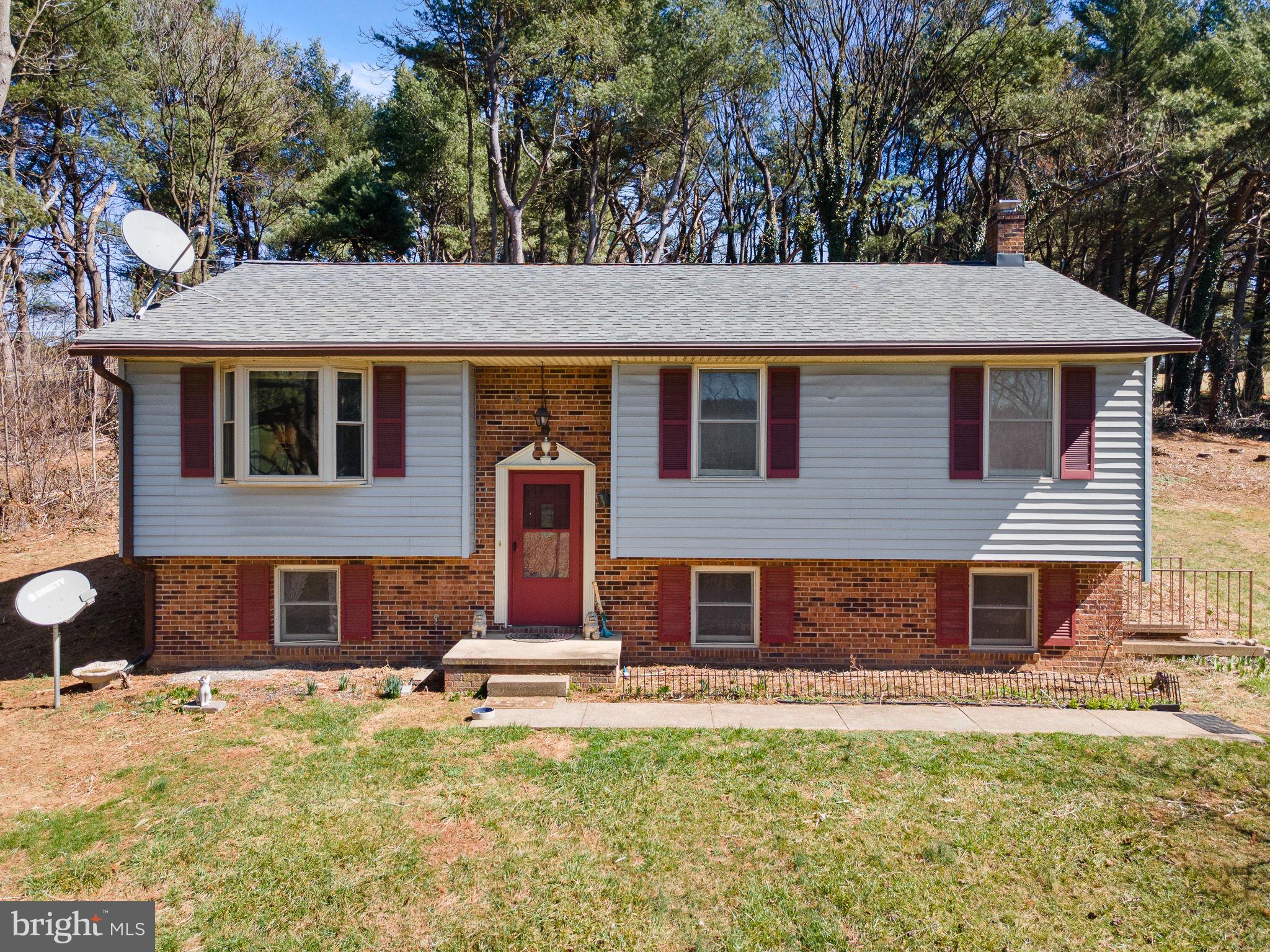 6794 Ottobine Road Dayton, VA 22821 - Photo 1 of 32 a front view of a house with a yard