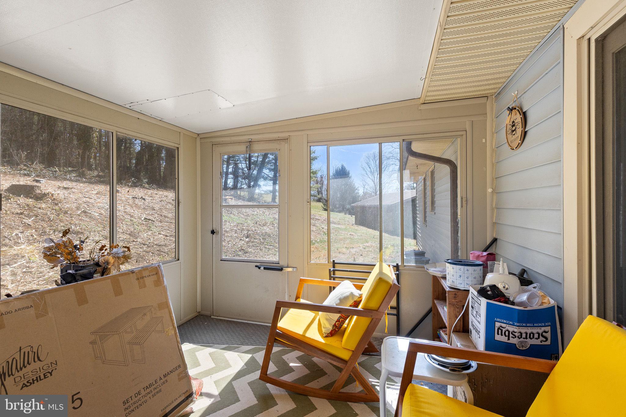6794 Ottobine Road Dayton, VA 22821 - Photo 13 of 32 a living room with furniture and a large window