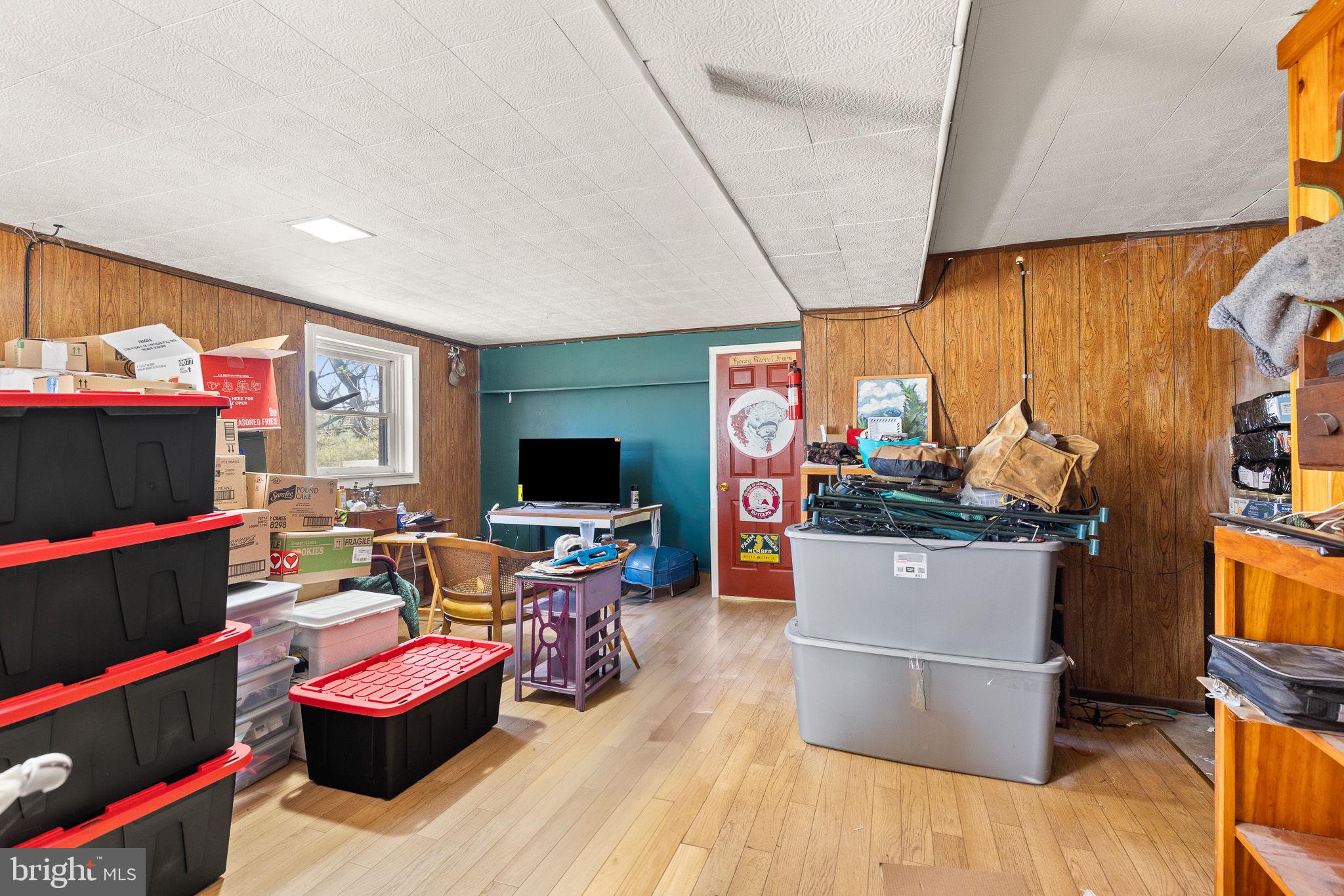 6794 Ottobine Road Dayton, VA 22821 - Photo 28 of 32 a room with furniture a flat screen tv and a view of kitchen