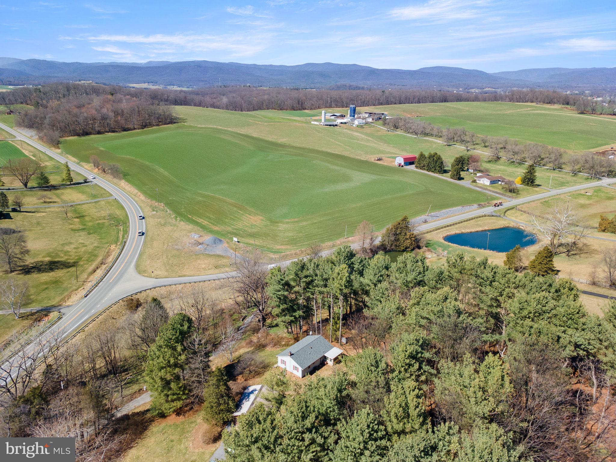 6794 Ottobine Road Dayton, VA 22821 - Photo 32 of 32 a view of a lush green hillside and houses