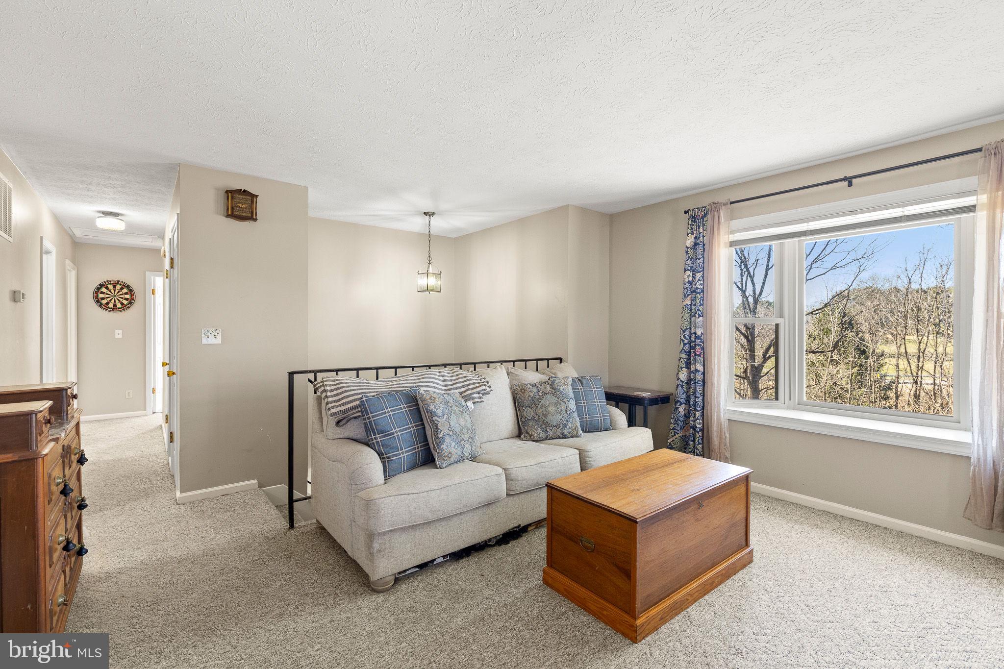 6794 Ottobine Road Dayton, VA 22821 - Photo 8 of 32 a living room with furniture and a large window