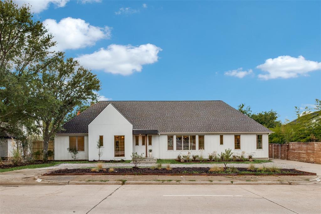 11131 Hillcrest Road Dallas, TX 75230 - Photo 2 of 24 a front view of a house with a yard