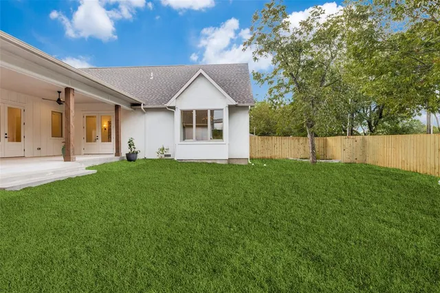 a living room with furniture and a large mirror