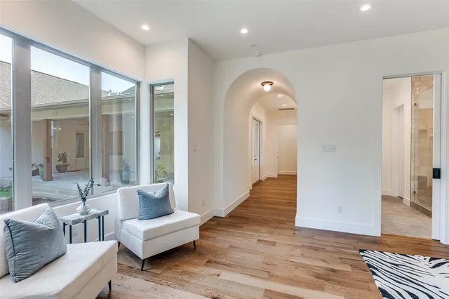 a view of a hallway view with wooden floor and staircase