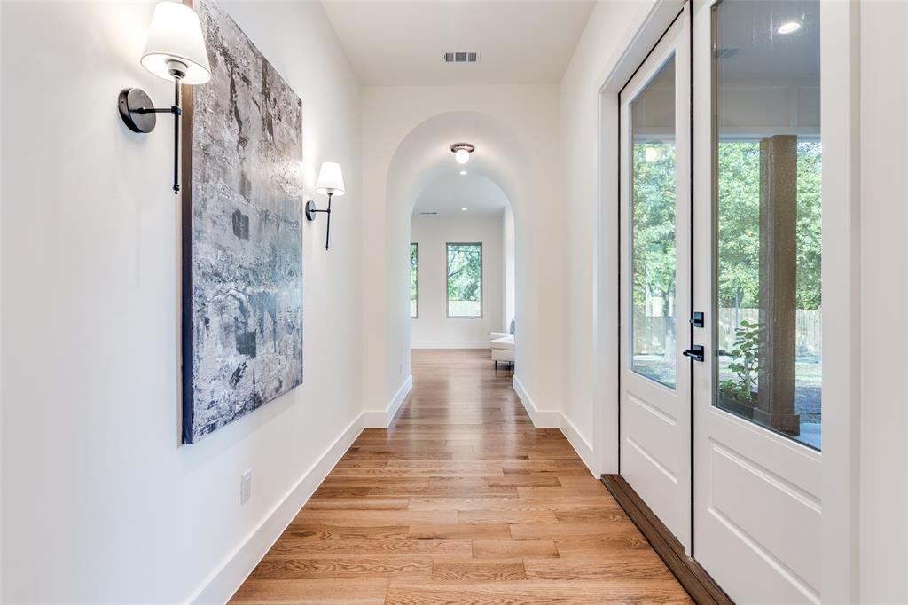 11131 Hillcrest Road Dallas, TX 75230 - Photo 24 of 24 a view of a hallway view with wooden floor and staircase