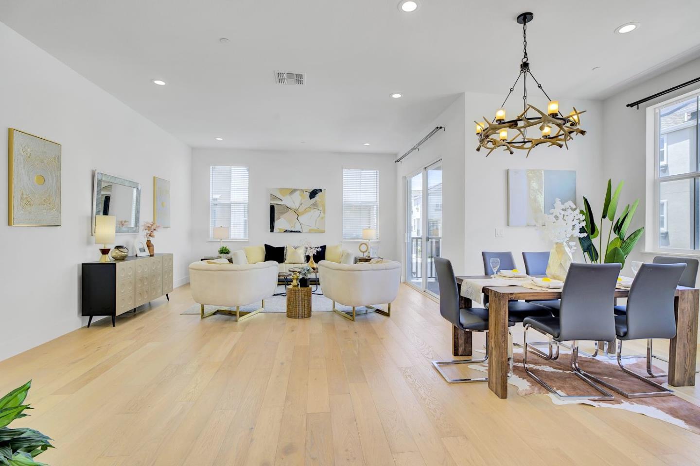 a living room with furniture chandelier and a chandelier