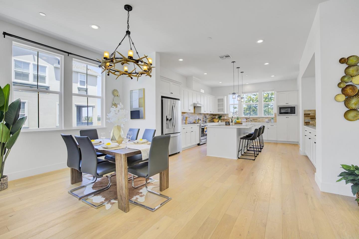37356 Suncrest Street Newark, CA 94560 - Photo 11 of 47 a dining room filled counter top space and a dining table with kitchen view