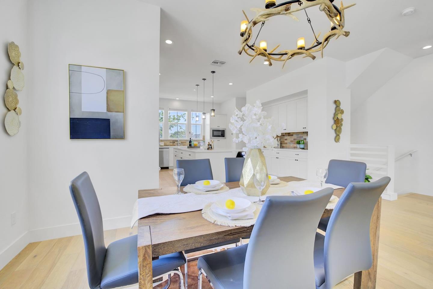 37356 Suncrest Street Newark, CA 94560 - Photo 13 of 47 a view of a dining room with furniture a chandelier and wooden floor