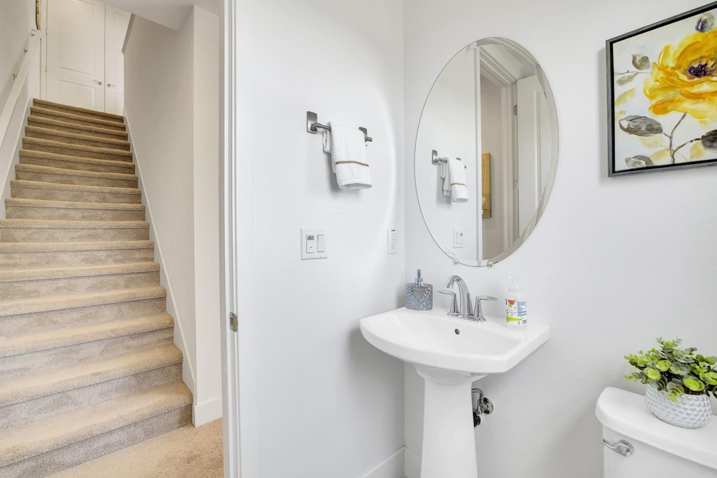 37356 Suncrest Street Newark, CA 94560 - Photo 18 of 47 a bathroom with a sink and mirror