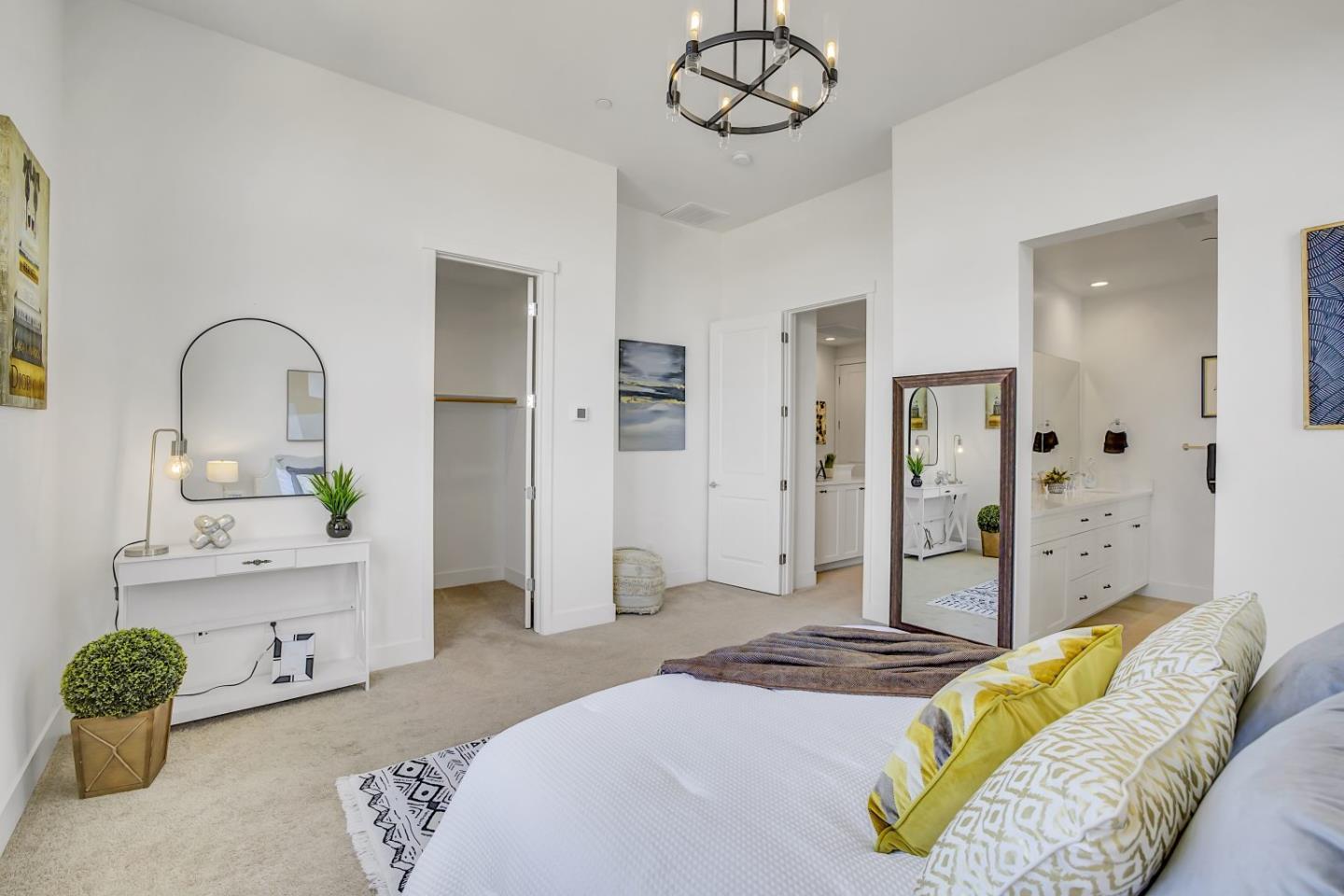 37356 Suncrest Street Newark, CA 94560 - Photo 31 of 47 a spacious bedroom with a bed a chandelier and mirror