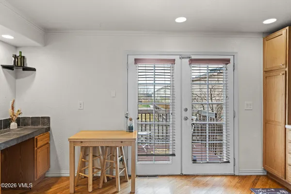 a view of front door with wooden floor