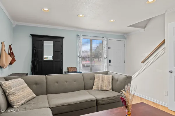 a living room with furniture and a large window