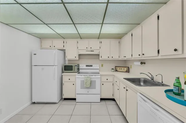 a kitchen with cabinets and appliances