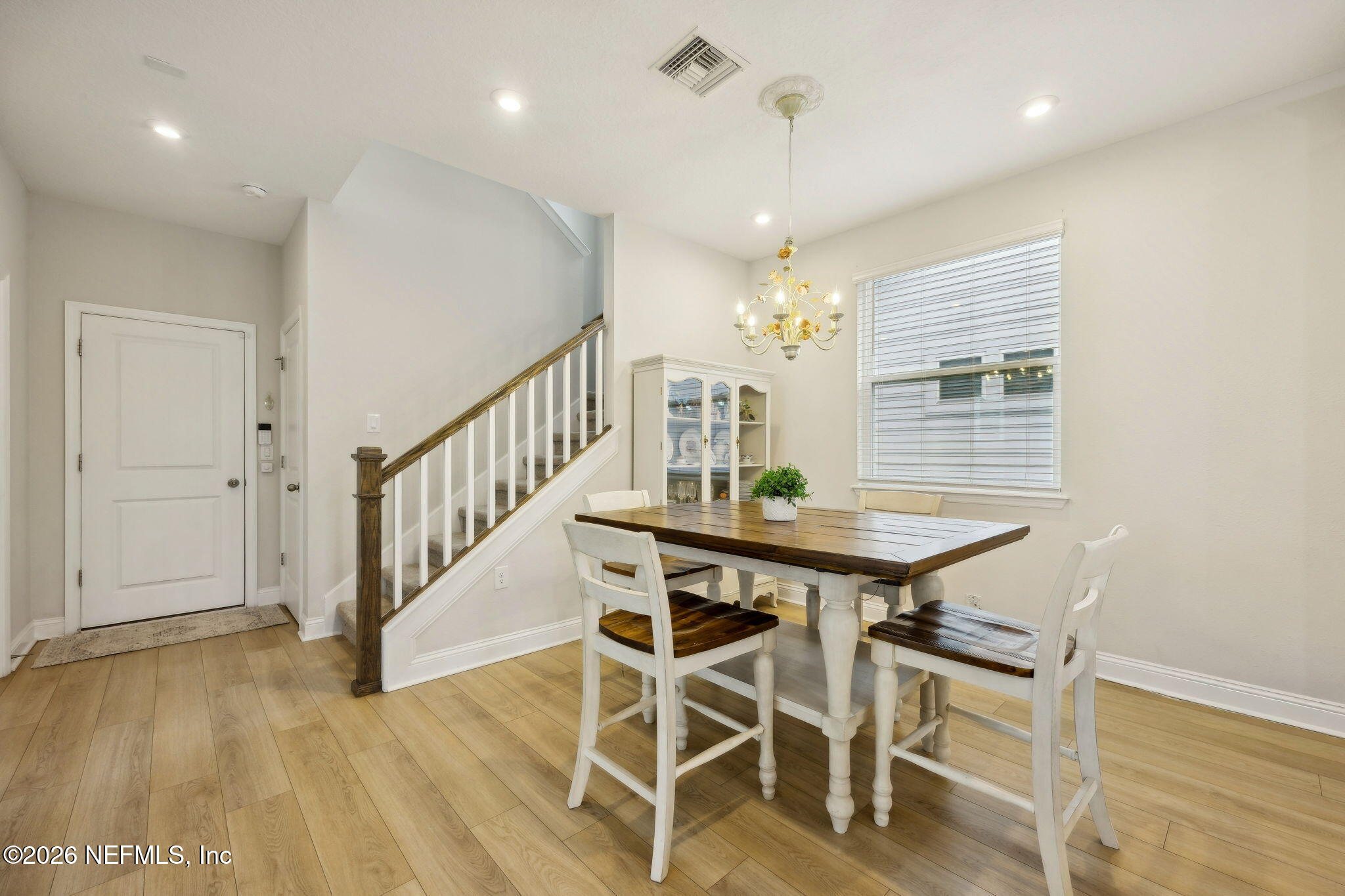 141 Redbud Lane Yulee, FL 32097 - Photo 23 of 77 a view of a dining room with furniture and wooden floor