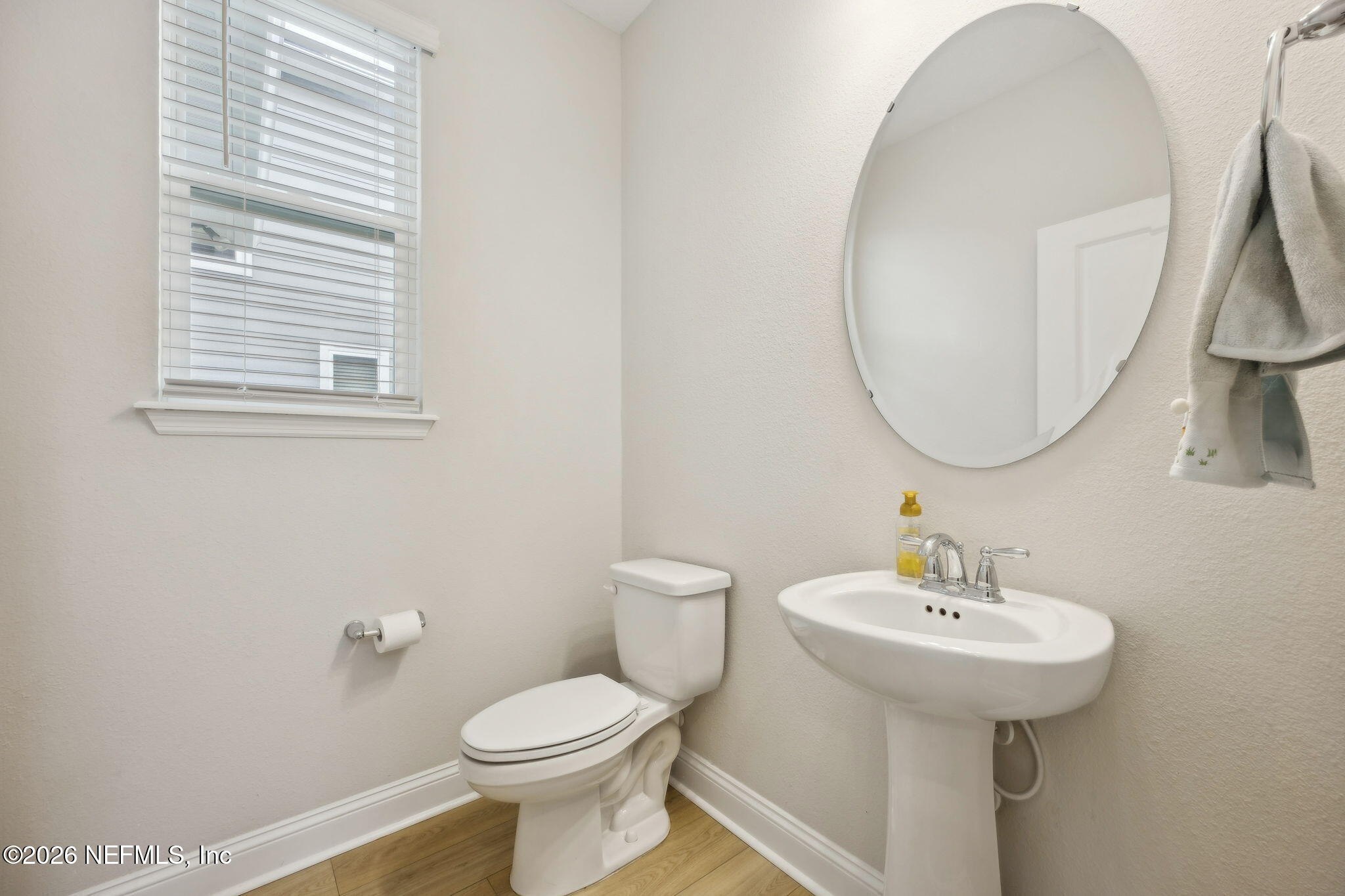 141 Redbud Lane Yulee, FL 32097 - Photo 25 of 77 a bathroom with a toilet sink and mirror