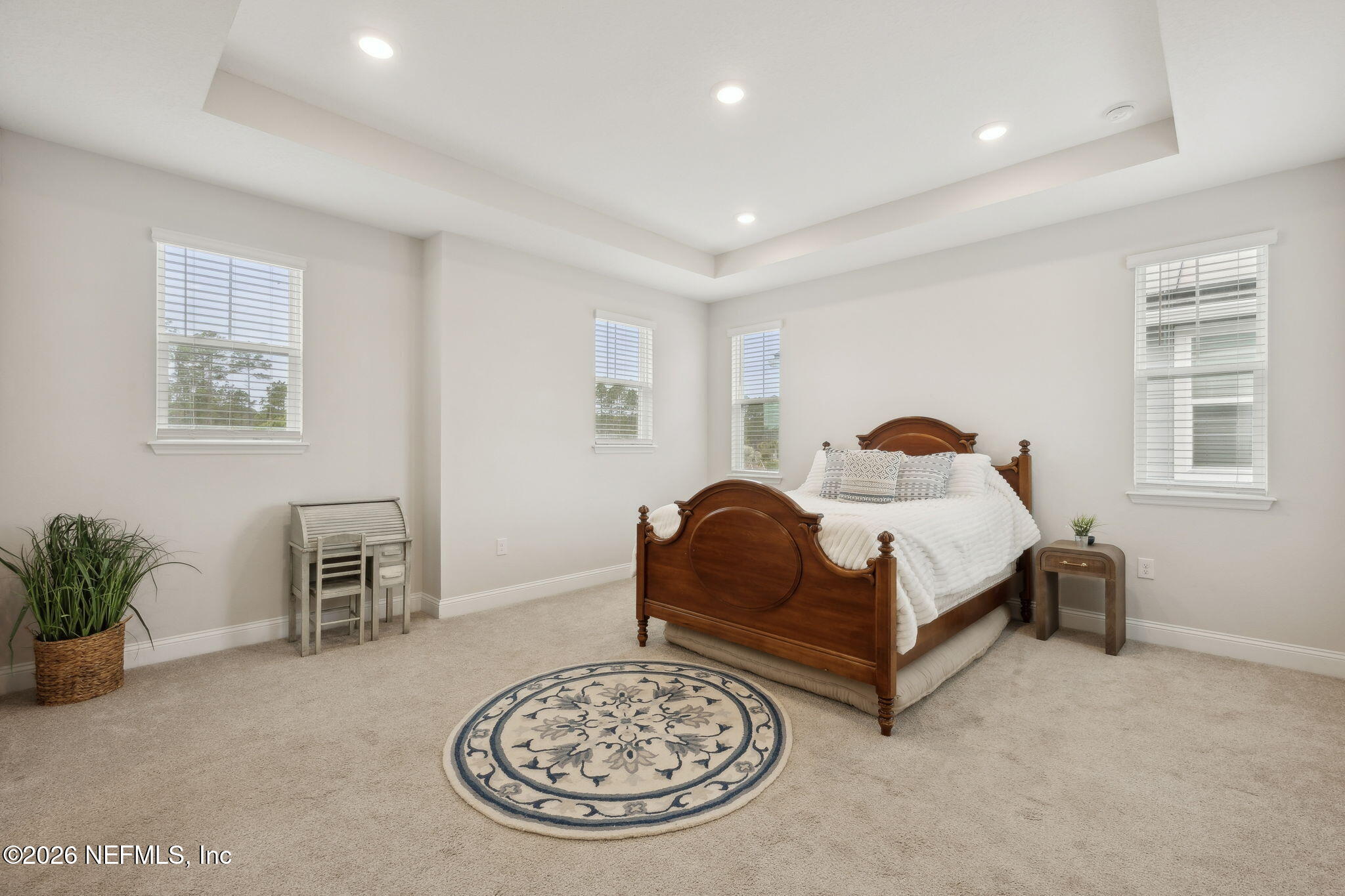 141 Redbud Lane Yulee, FL 32097 - Photo 28 of 77 a bedroom with a bed and a couch